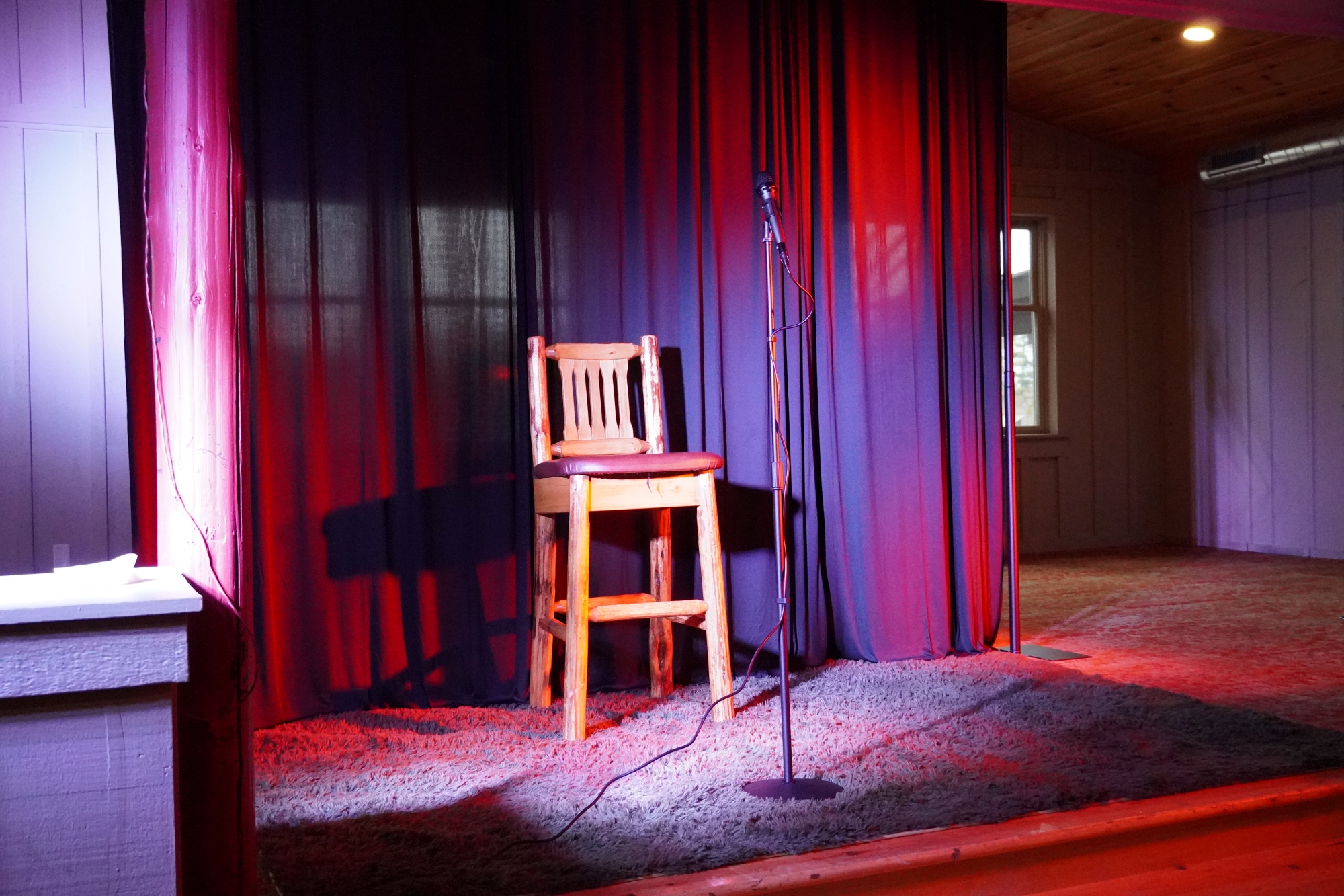 Chair on a stage with microphone for Comedy Night