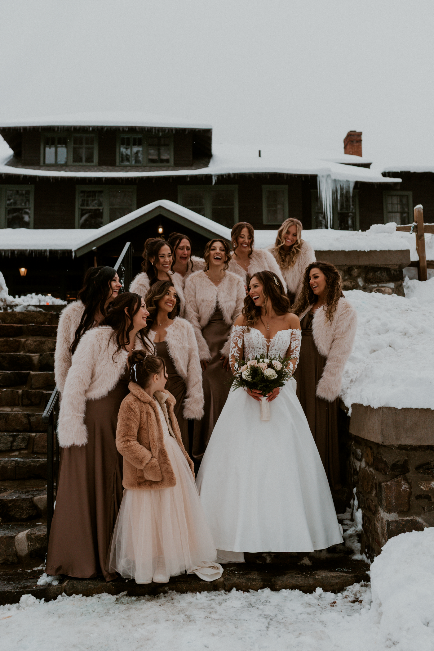 bride and bridal party in snow at lodge at Schroon lake