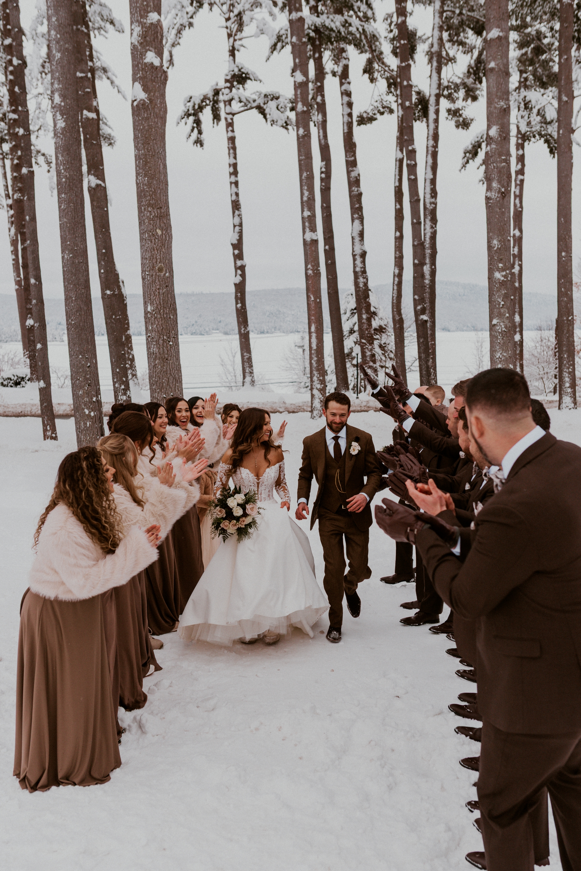 Couple walking down the aisle by Nina Sheffield
