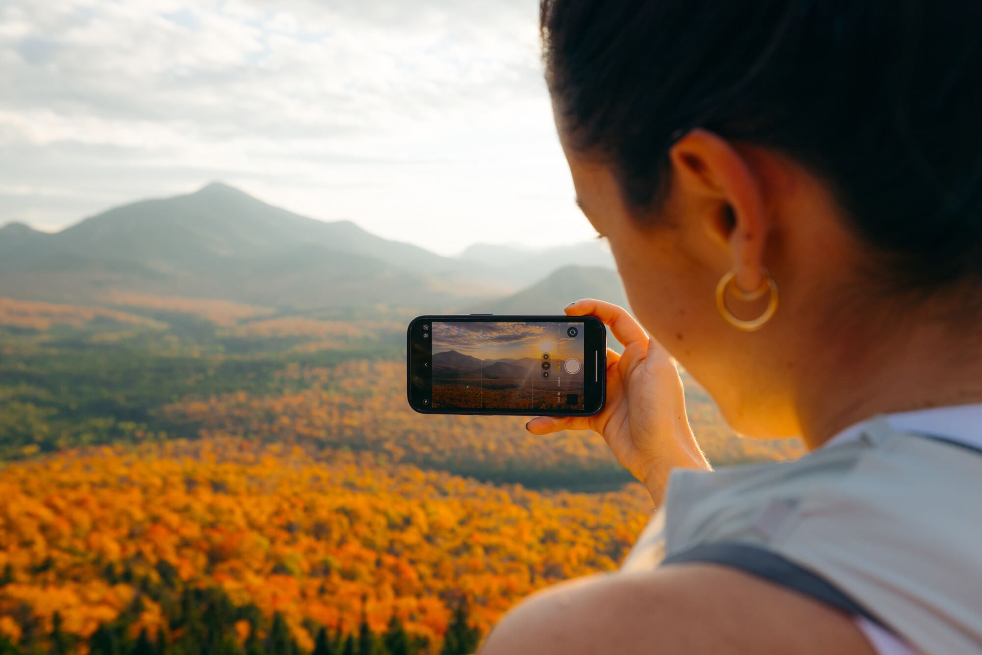 Women Talking A Picture Of The Foliage